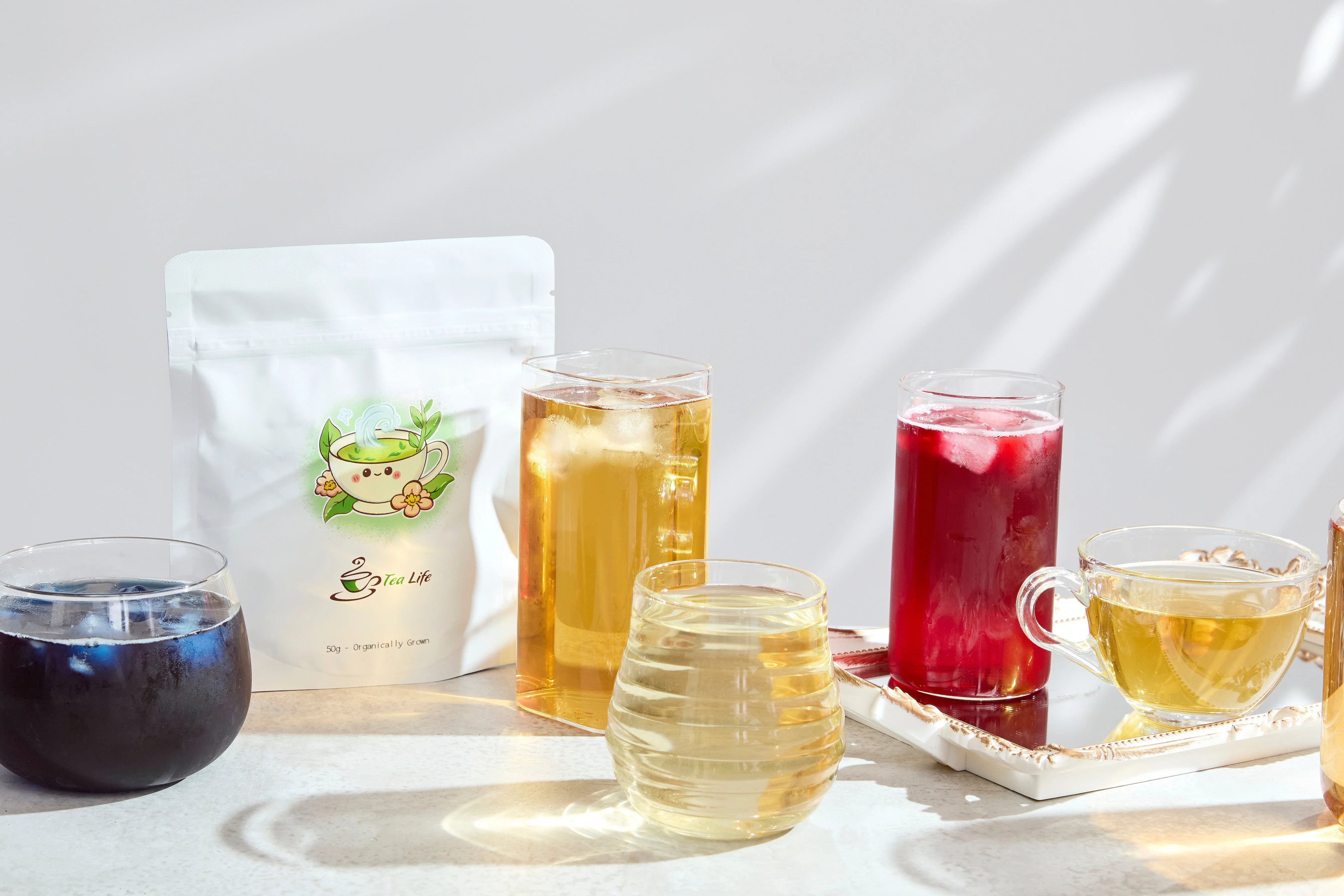 Wholesale Tea Hero Image featuring multiple iced teas in glasses.